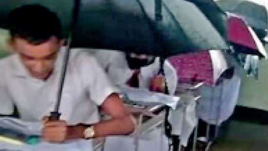 Sitting for O/L examination with umbrellas:  Will take disciplinary action: Exam Com. Gen.