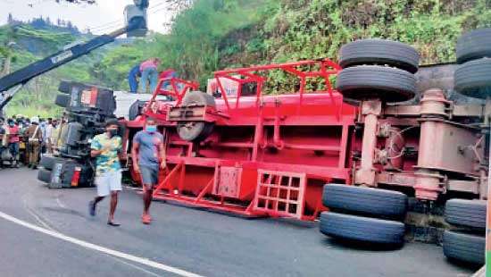 Bowser transporting fuel topples