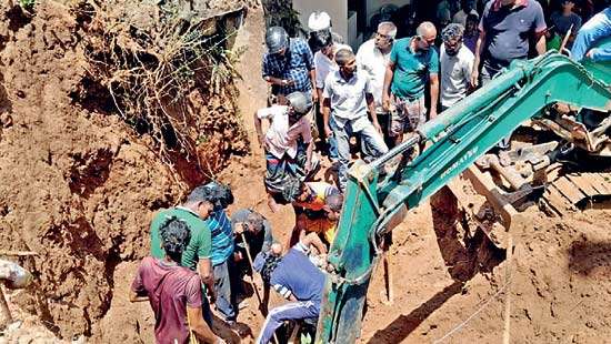 Wall collapses killing three construction workers