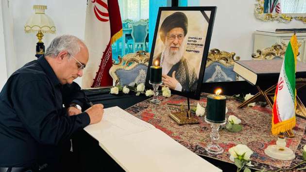 Opens condolence book...