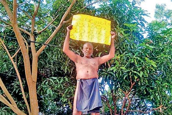 Farmer protests on bus halt roof over delayed fertilizer subsidy
