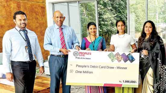 People’s Bank presents prizes to winners at debit card grand draw