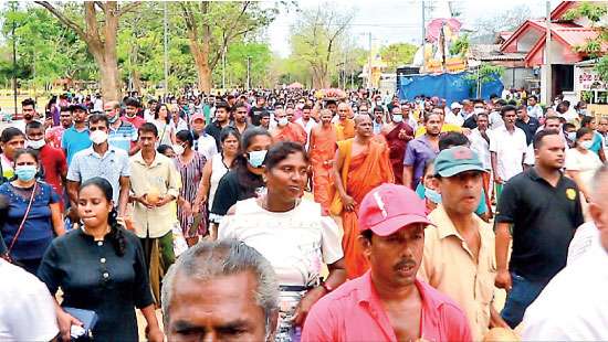 Residents in Kataragama dash coconuts