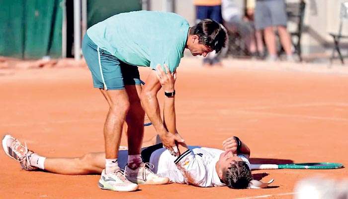 French Open player collapses in sweltering conditions