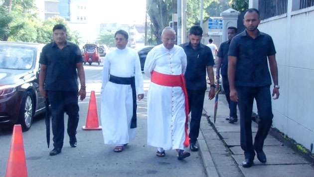 Cardinal Malcolm Ranjith casts his vote