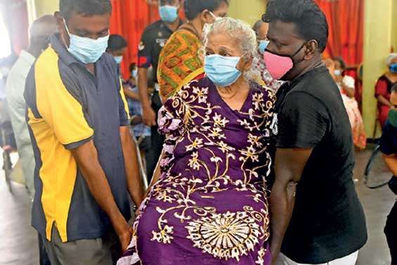 An old lady carried away after second jab