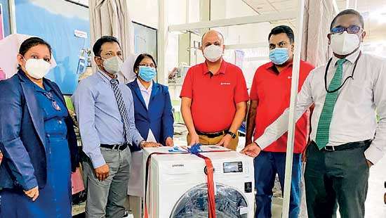 NDB donates washing machine to Covid Maternity Ward