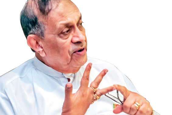 Karu condemns arson attack on Ranil’s residence