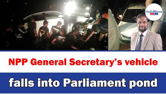 NPP General Secretary’s vehicle falls into Parliament pond