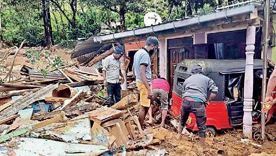 Earth slip at Kabaragala estate Sixty houses destroyed, three critically injured