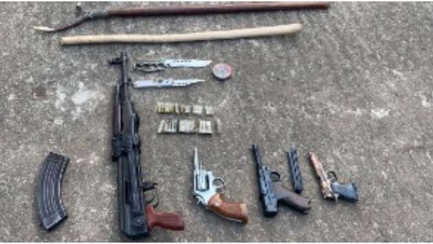 Airport guard arrested with cache of weapons
