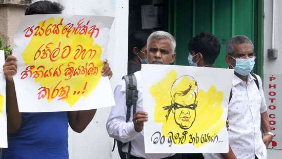 Urging Ranil to resign