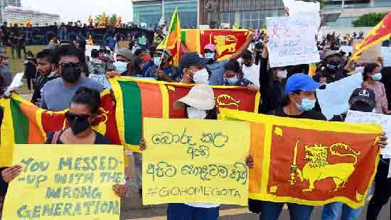 Youth throng Galle Face Green