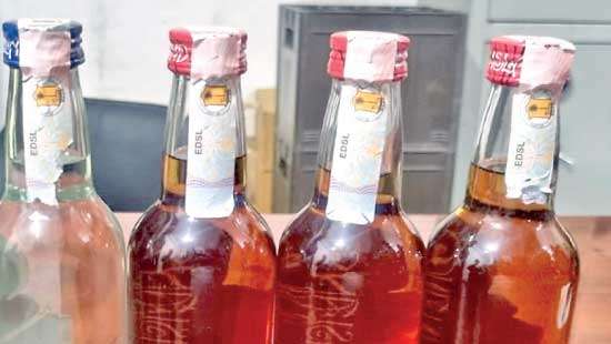 Following Wijeyadasa s revelation in Parliament  Excise detects booze bottles with fake stickers at countrywide locations