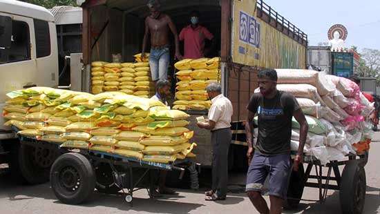 Unloading rice sacks...