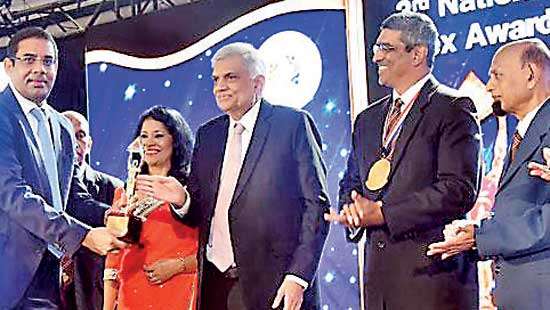 Dinesh recognized for contribution to banking industry