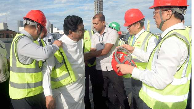 Minister officiates elevated highway bridge connection