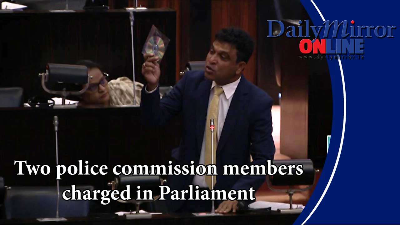 Two police commission members charged in Parliament