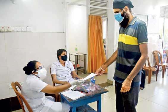 Indian construction worker in Colombo receives Chinese Sinopharm jab