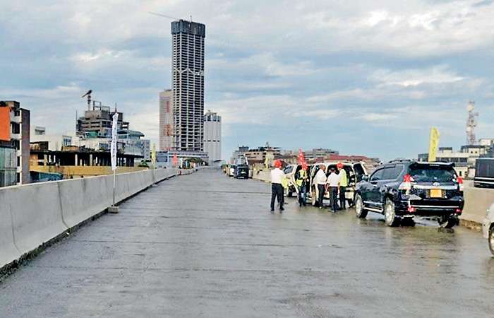 Minister officiates elevated highway bridge connection