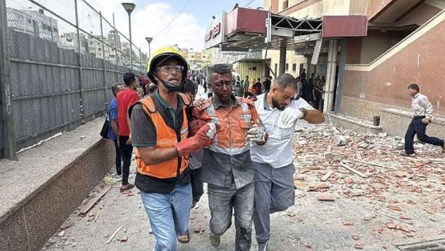 Five journalists among 20 killed in Israeli strike on hospital, Gaza officials say