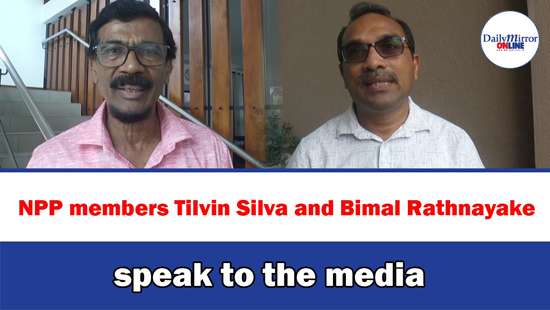 NPP members Tilvin Silva and Bimal Rathnayake speak to the media