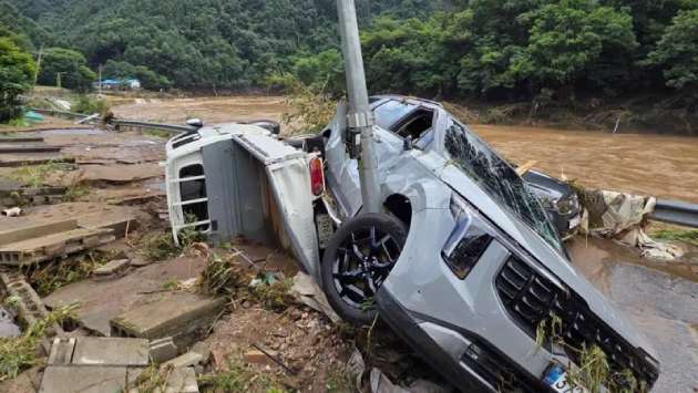At least 14 dead in South Korea floods and landslides