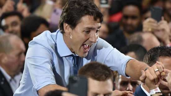 Justin Trudeau wins narrow victory to form minority government