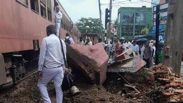 Wall fall halts trains...