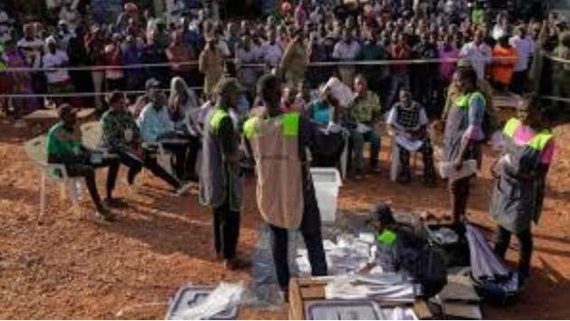 Uganda’s president leads in tense election marred by internet shutdown