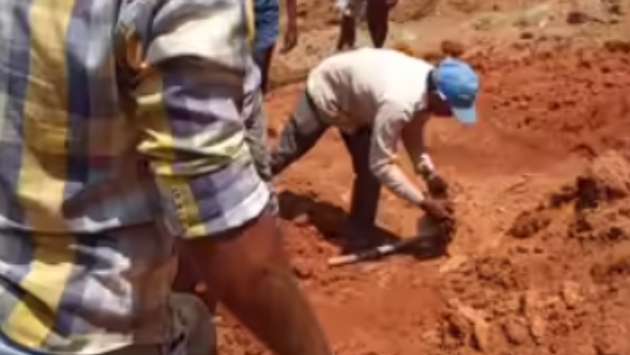 Workers trapped as earth collapses at construction site