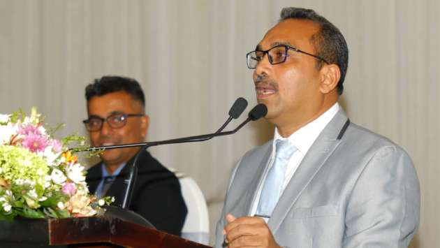 Minister urges professionals to unite for national development