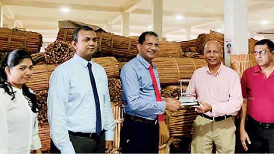 DFCC Bank recognises key cinnamon import clients and their contribution