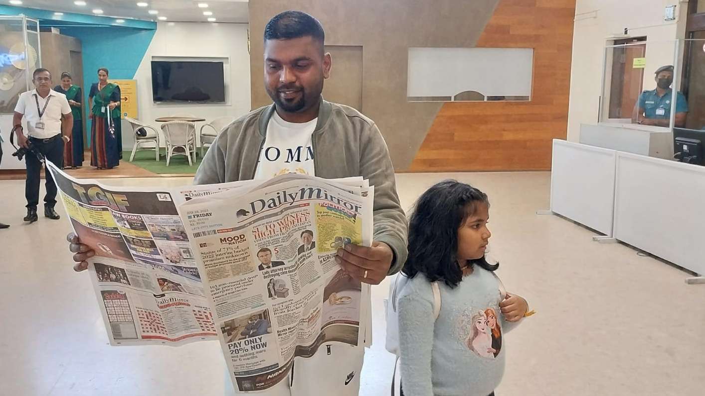 France’s finest bread maker reads Daily Mirror after arrival