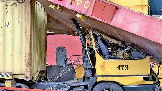 Hatch Cover crushes truck at Colombo Port: driver injured