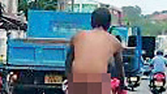 Naked man caught on camera riding  bicycle in Kandana town