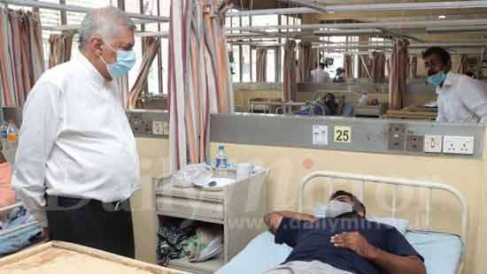 Ranil visits Titus Perera at hospital