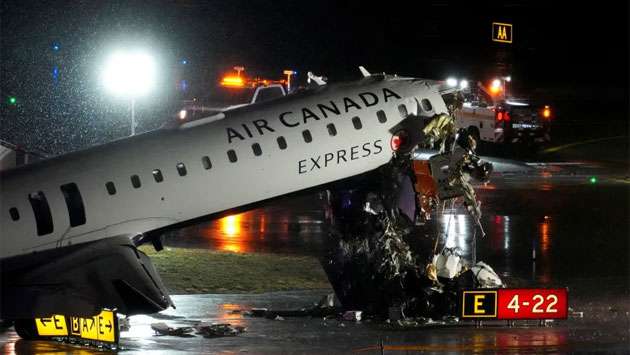 2 killed, dozens injured after Air Canada flight hits fire truck on runway at LaGuardia Airport, official says