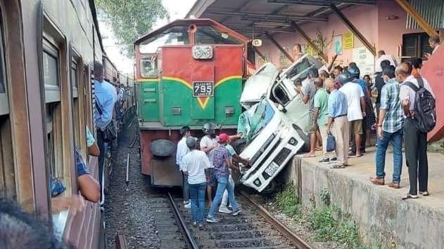 One dead as car dragged along platform after hitting express train
