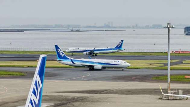 Japan flight made emergency landing after man tried opening door