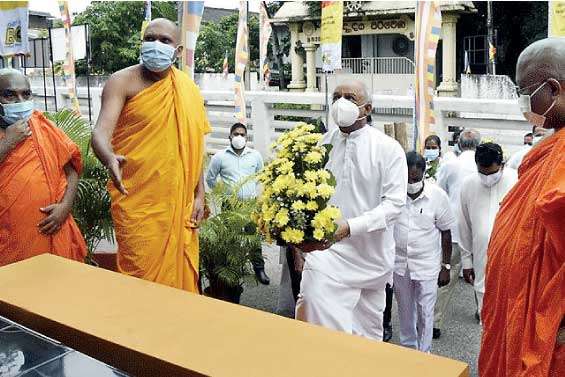 Floral tributes paid to the statue of Srimath Anagarika Dharmapala