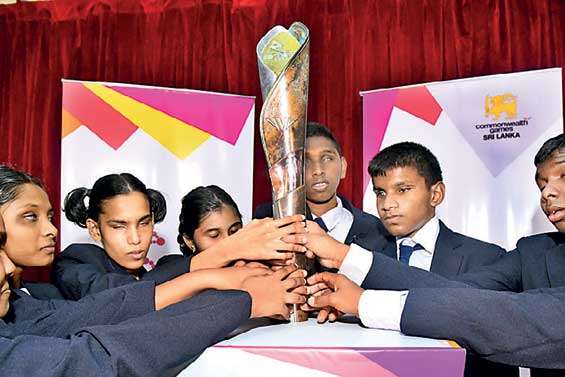 Children with special needs hold the Queen’s Baton