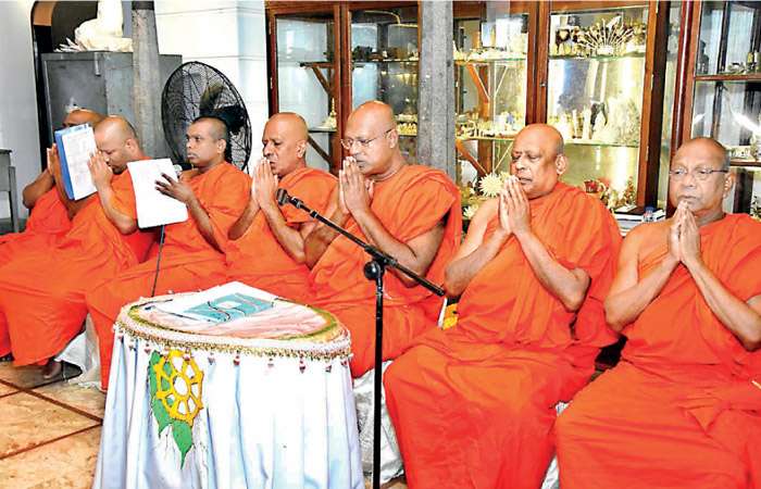 Buddhist monks conduct Atavisi Buddha Pooja at Gangaramaya Temple