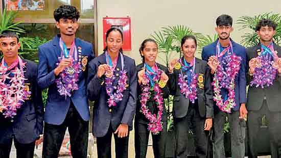 Athletes return with eight medals