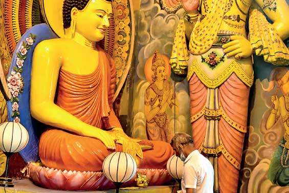 Devotees at Gangarama Temple on Duruthu Poya Day