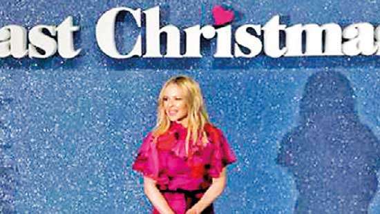 Kylie invites politics-weary Brits to ’call on your friends in Australia’