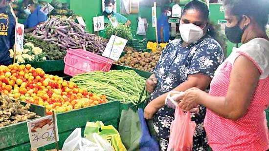 People purchasing essentials at Narahenpita EC