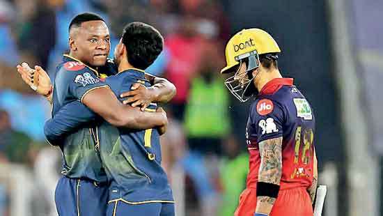 Defending champs RCB brought down by Gujarat Titans