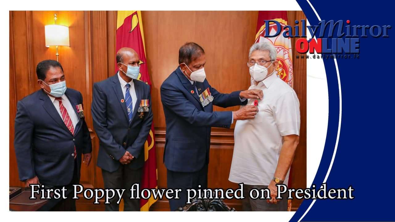 First Poppy flower pinned on President