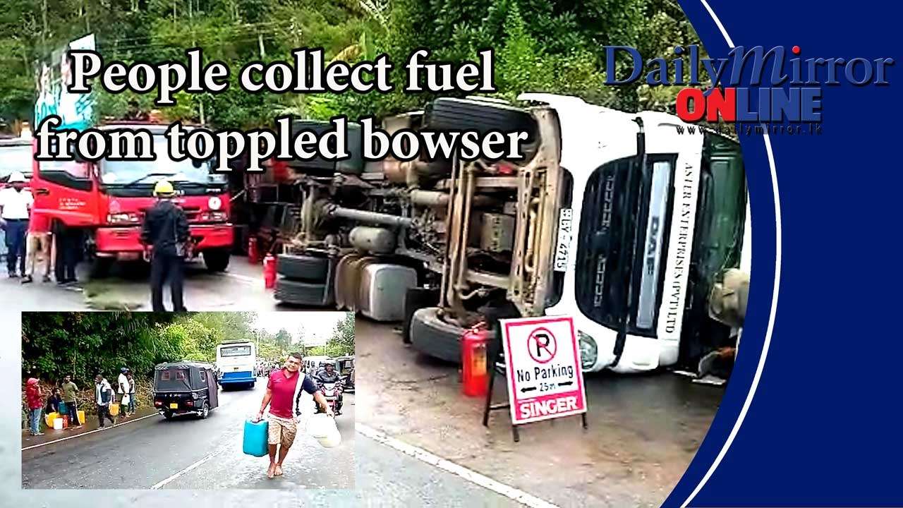 People collect fuel from toppled bowser